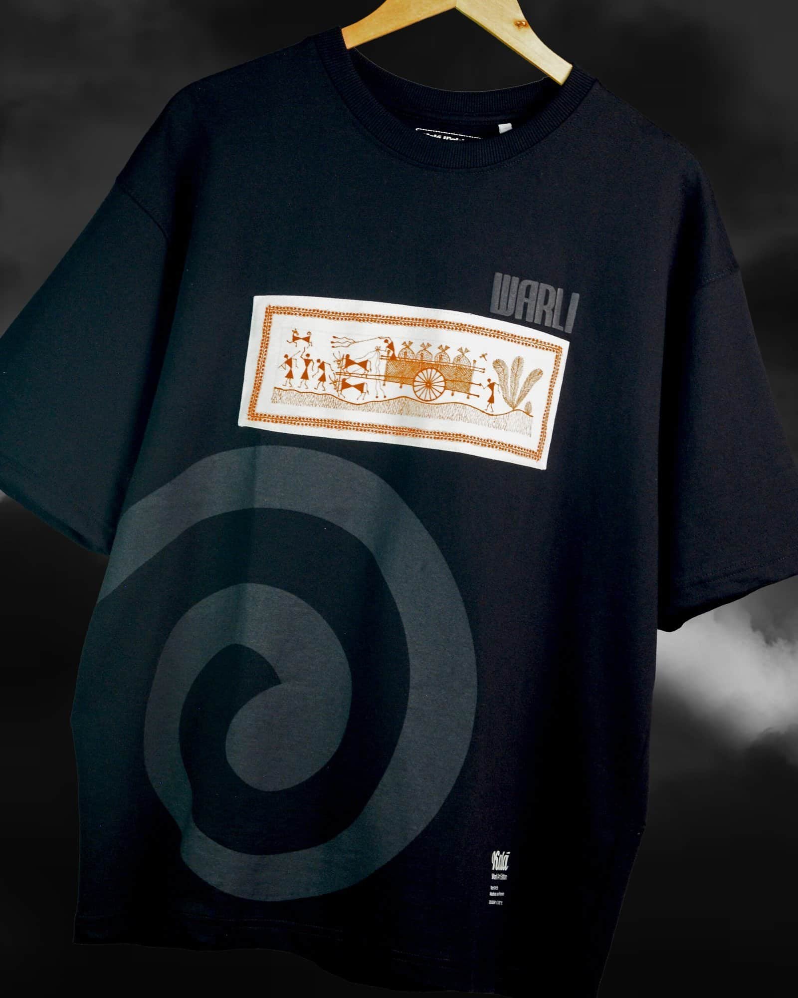 Hand painted Warli art t-shirt. Black t-shirt with authentic tribal artwork by Warli artisans.