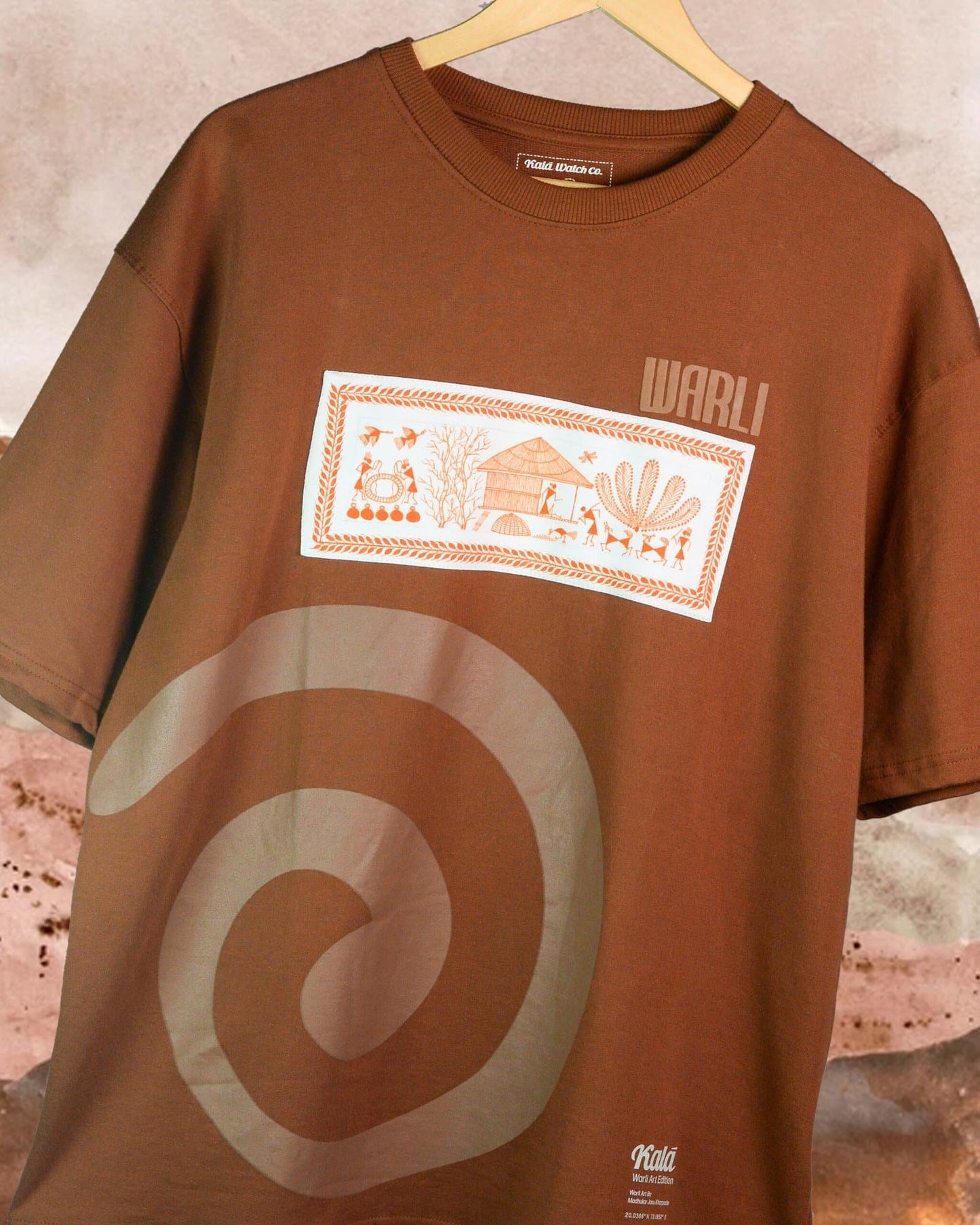 Hand painted Warli art t-shirt. Brown t-shirt with authentic tribal artwork by Warli artisans.