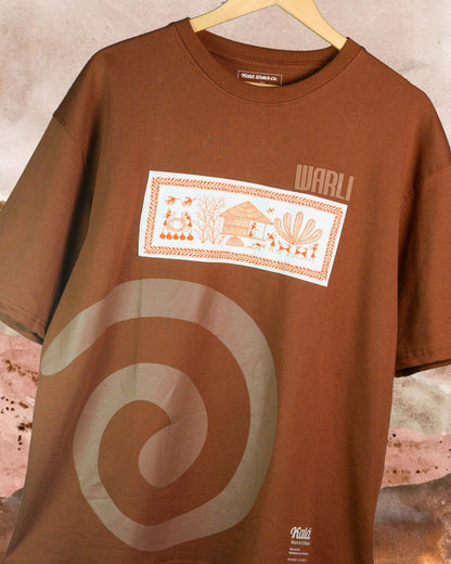 Hand painted Warli art t-shirt. Brown t-shirt with authentic tribal artwork by Warli artisans.