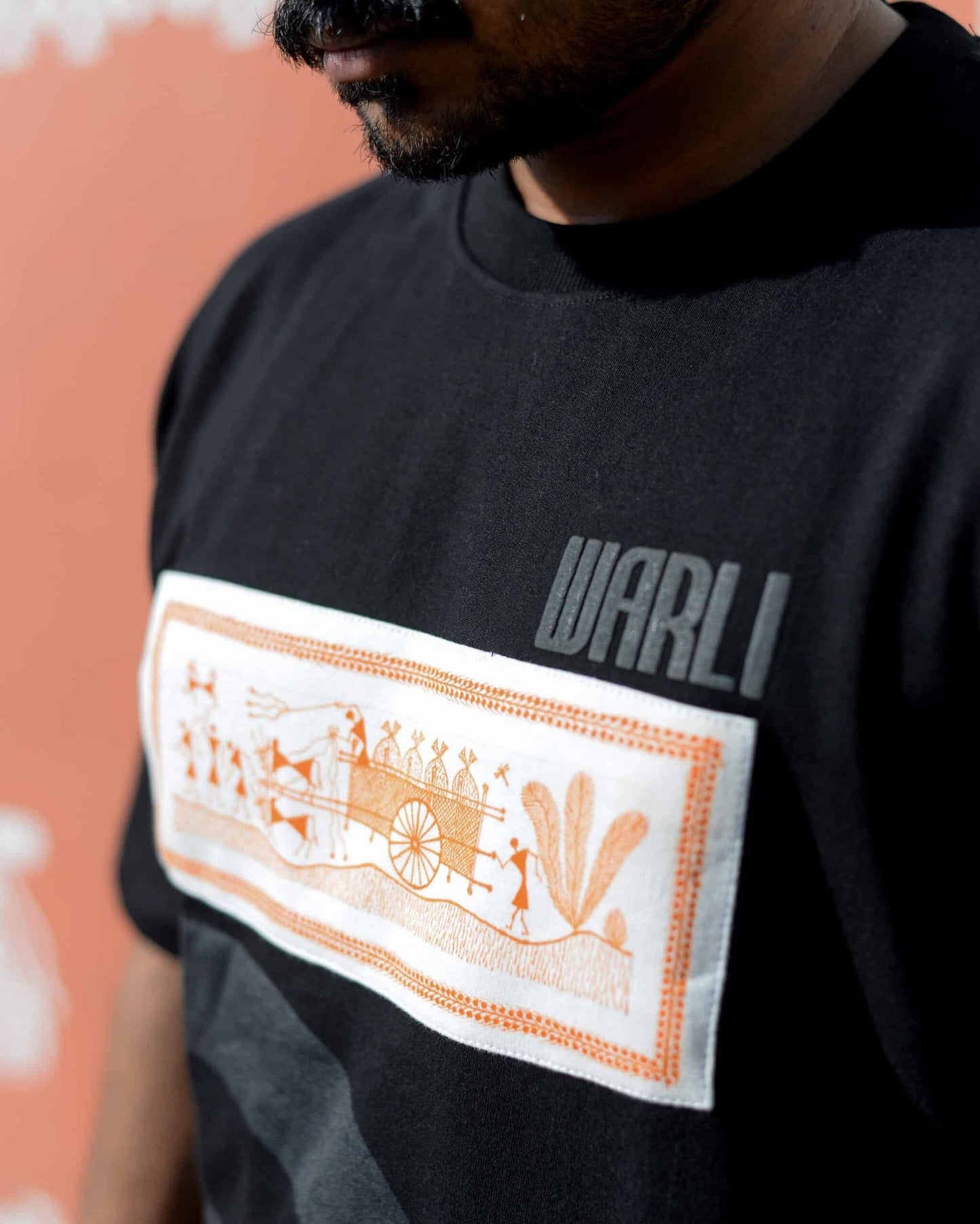 Hand painted Warli art t-shirt. Black t-shirt with authentic tribal artwork by Warli artisans.