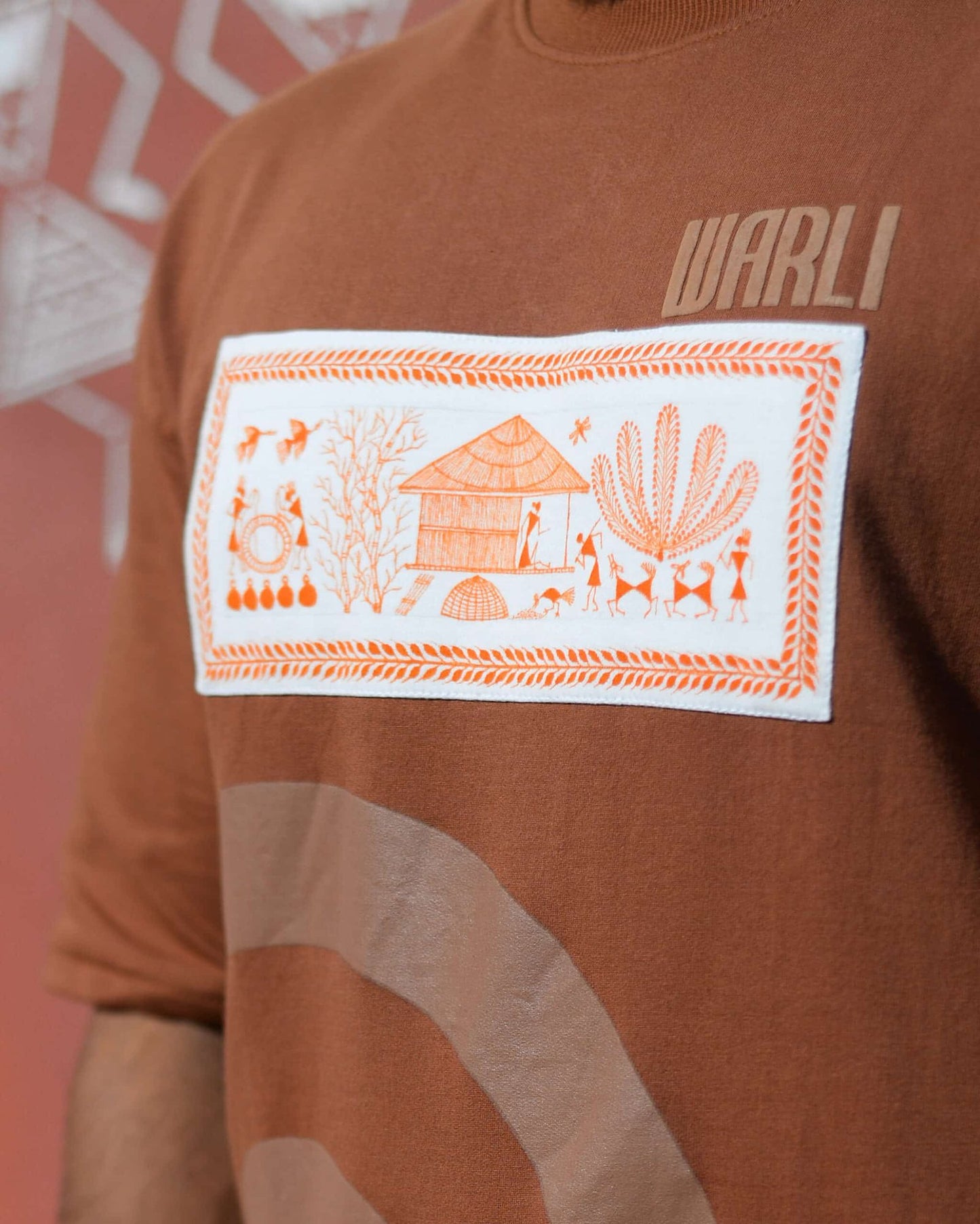Hand painted Warli art t-shirt. Brown t-shirt with authentic tribal artwork by Warli artisans.