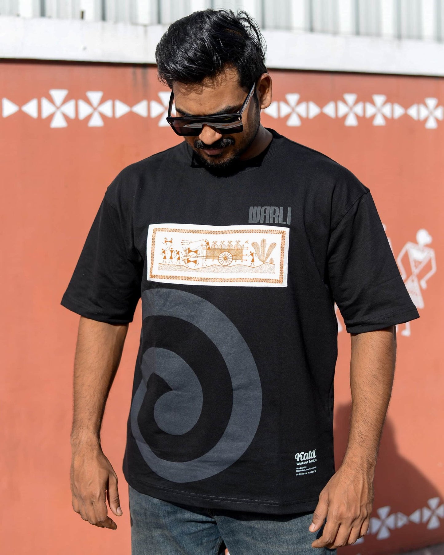Hand painted Warli art t-shirt. Black t-shirt with authentic tribal artwork by Warli artisans.
