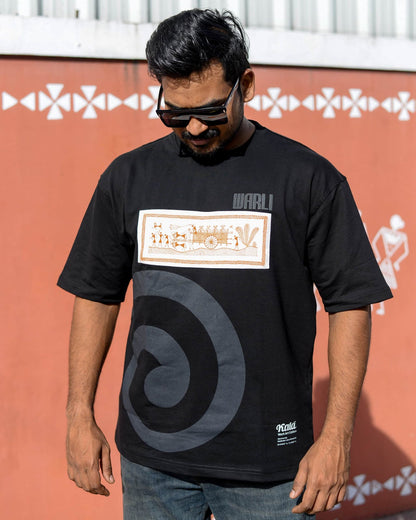 Hand painted Warli art t-shirt. Black t-shirt with authentic tribal artwork by Warli artisans.