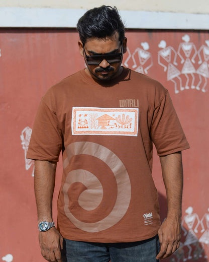 Hand painted Warli art t-shirt. Brown t-shirt with authentic tribal artwork by Warli artisans.