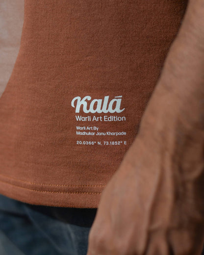 Hand painted Warli art t-shirt. Brown t-shirt with authentic tribal artwork by Warli artisans.