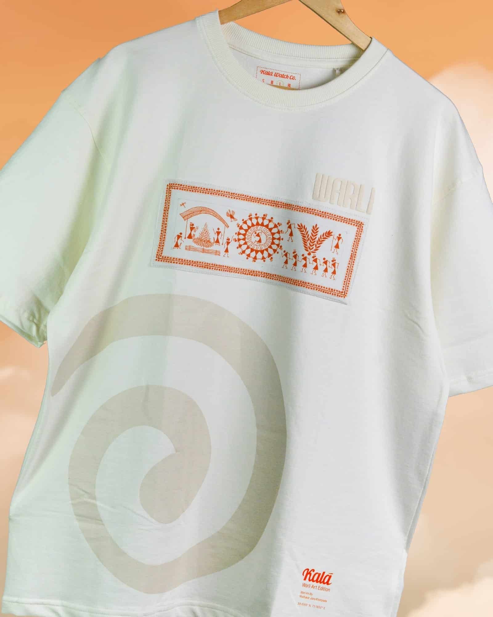 Hand painted Warli art t-shirt. Off-white t-shirt with authentic tribal artwork by Warli artisans.